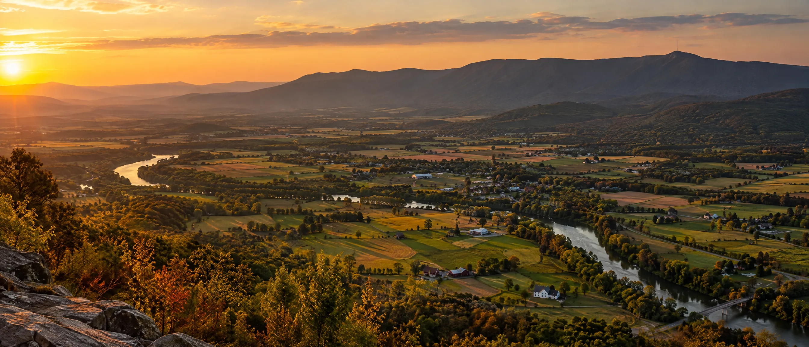 The Page Valley from a Skyline Drive overlook at sunset, the Shenandoah River bending through farmland